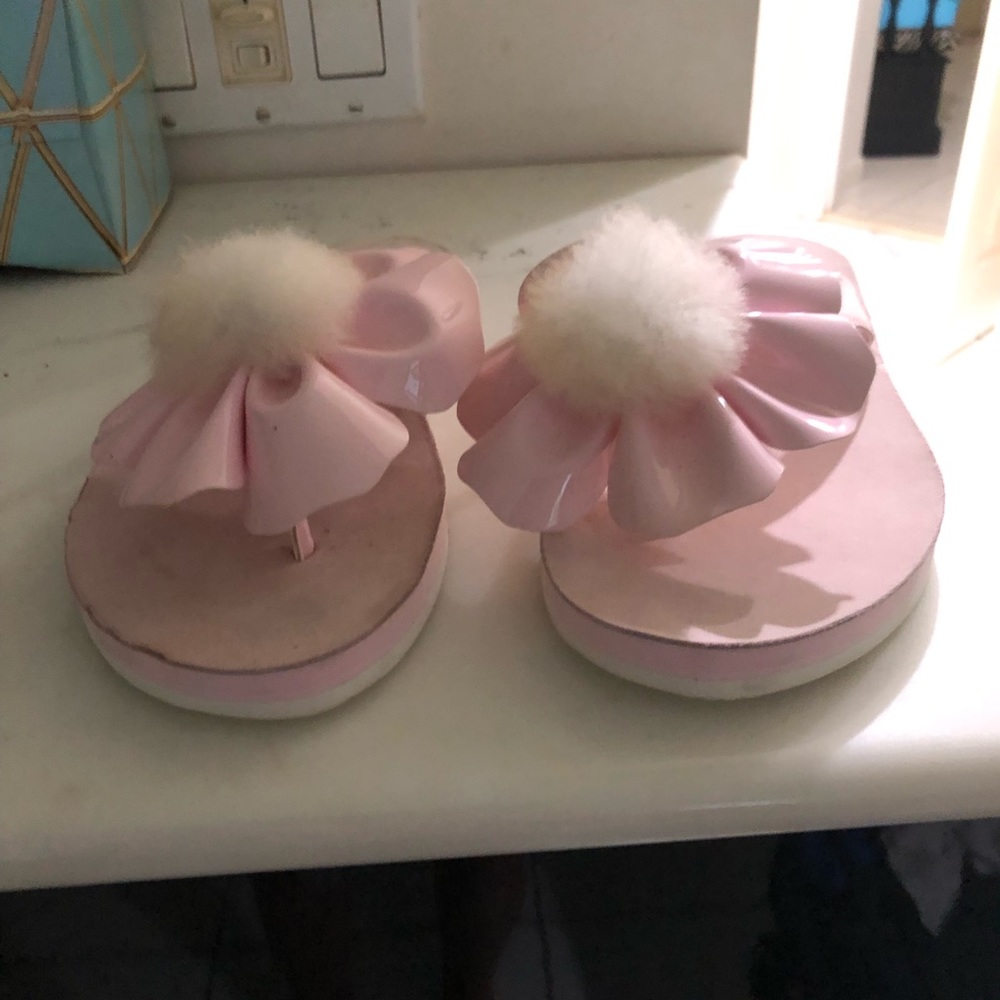 UGG Poppy Pink Flower Pom Pom Flip Flops Size 6. Never worn. New without tag